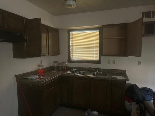 3437 Ridgemont Avenue Memphis, TN 38128 - Photo 5 of 16 Kitchen featuring sink and dark brown cabinetry