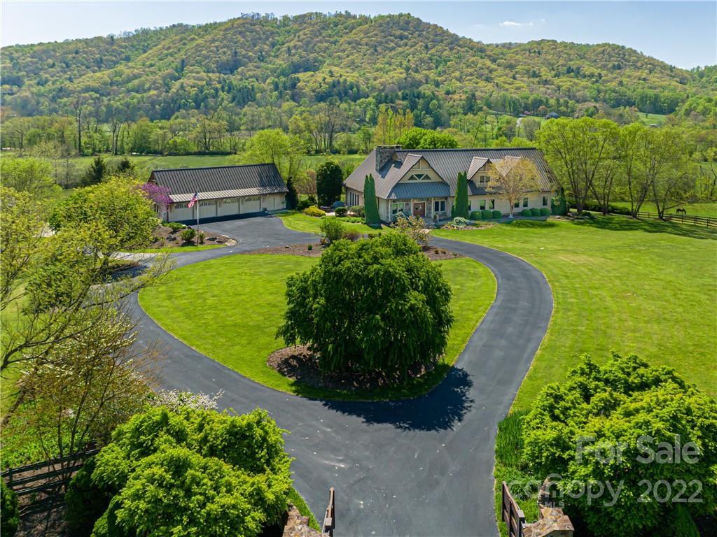 1030 Cane Creek Road Fletcher, NC 28732 - Photo 1 of 48 an aerial view of a house with a garden