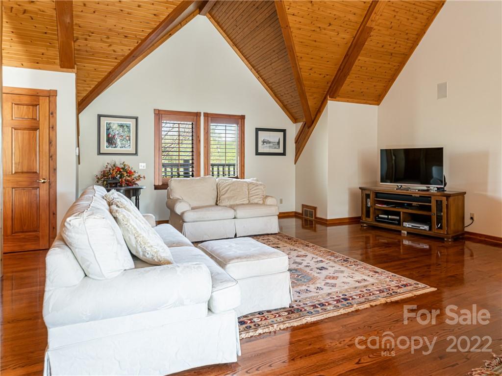 1030 Cane Creek Road Fletcher, NC 28732 - Photo 11 of 48 a living room with furniture and a flat screen tv