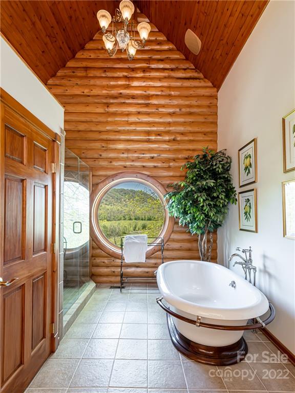 1030 Cane Creek Road Fletcher, NC 28732 - Photo 12 of 48 a bathroom with a toilet a sink and mirror