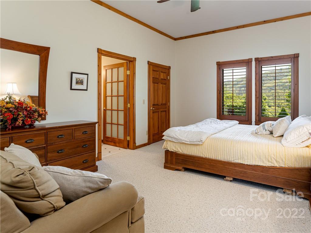 1030 Cane Creek Road Fletcher, NC 28732 - Photo 15 of 48 a spacious bedroom with a bed and window