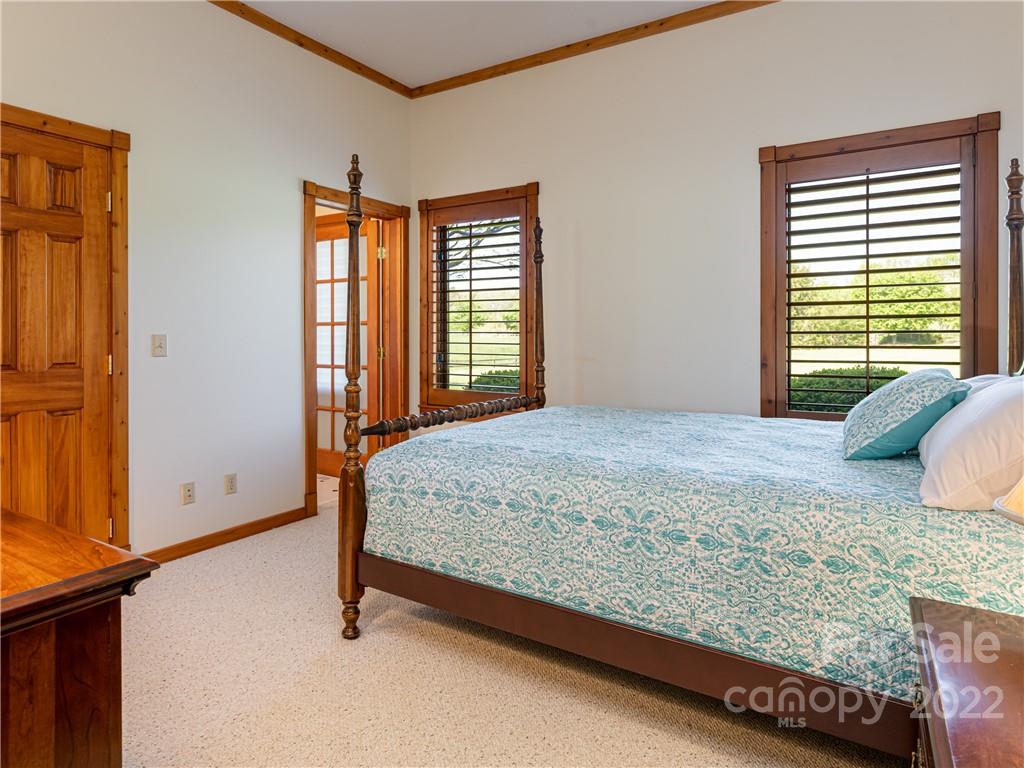 1030 Cane Creek Road Fletcher, NC 28732 - Photo 16 of 48 a bedroom with a bed and window