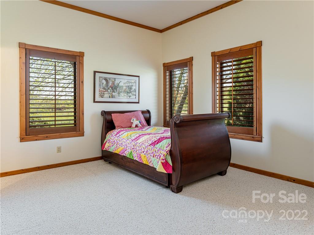 1030 Cane Creek Road Fletcher, NC 28732 - Photo 18 of 48 a bedroom with a bed and window