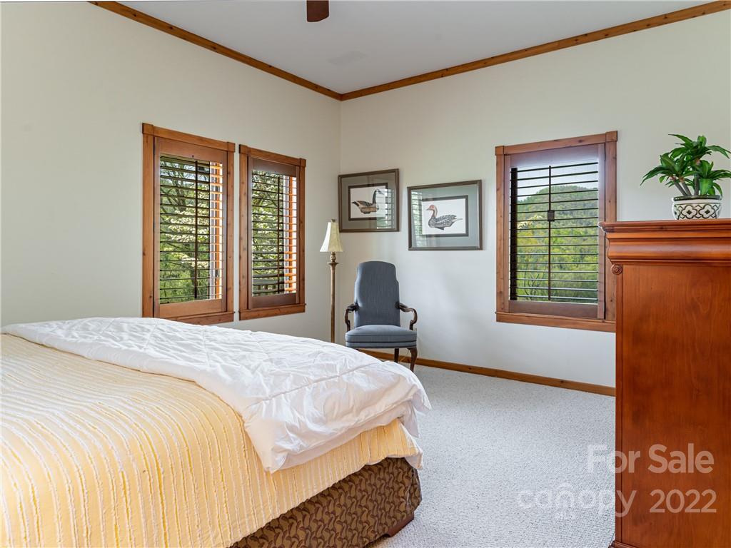 1030 Cane Creek Road Fletcher, NC 28732 - Photo 19 of 48 a bedroom with a bed and a window