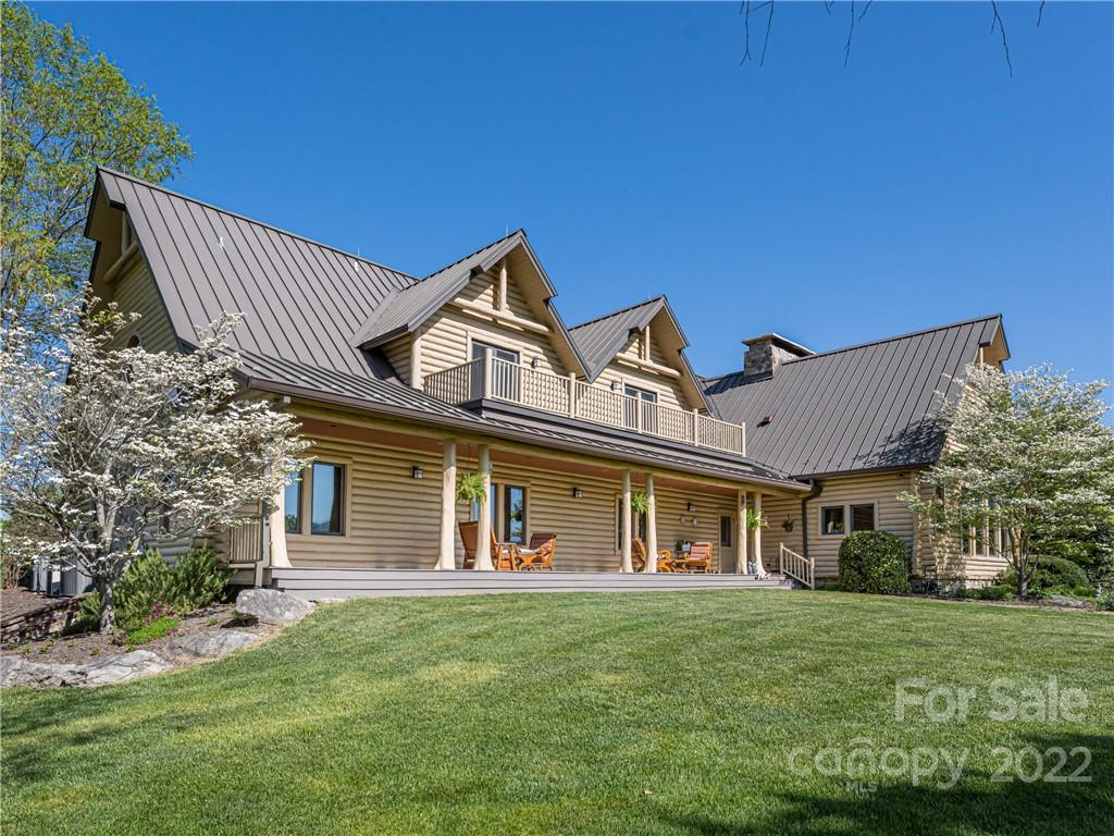 1030 Cane Creek Road Fletcher, NC 28732 - Photo 20 of 48 front view of a house with a garden