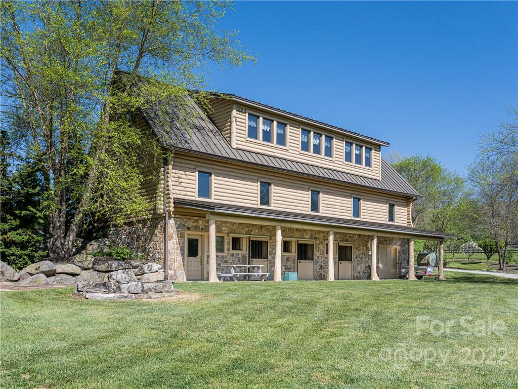1030 Cane Creek Road Fletcher, NC 28732 - Photo 26 of 48 a front view of a house with a garden