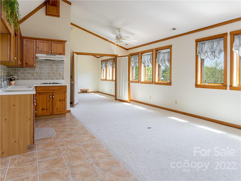 1030 Cane Creek Road Fletcher, NC 28732 - Photo 27 of 48 a view of a kitchen with a sink and dishwasher cabinets with wooden floor