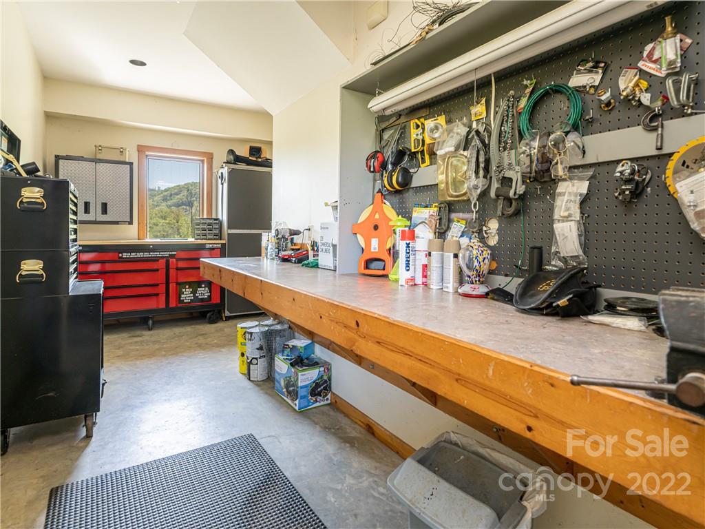 1030 Cane Creek Road Fletcher, NC 28732 - Photo 29 of 48 a room with gym equipment and a large window