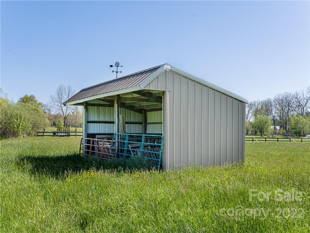 1030 Cane Creek Road Fletcher, NC 28732 - Photo 33 of 48 a view of a house with a yard
