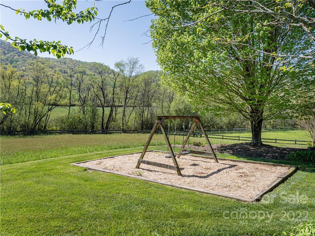 1030 Cane Creek Road Fletcher, NC 28732 - Photo 35 of 48 a view of a park with a slide