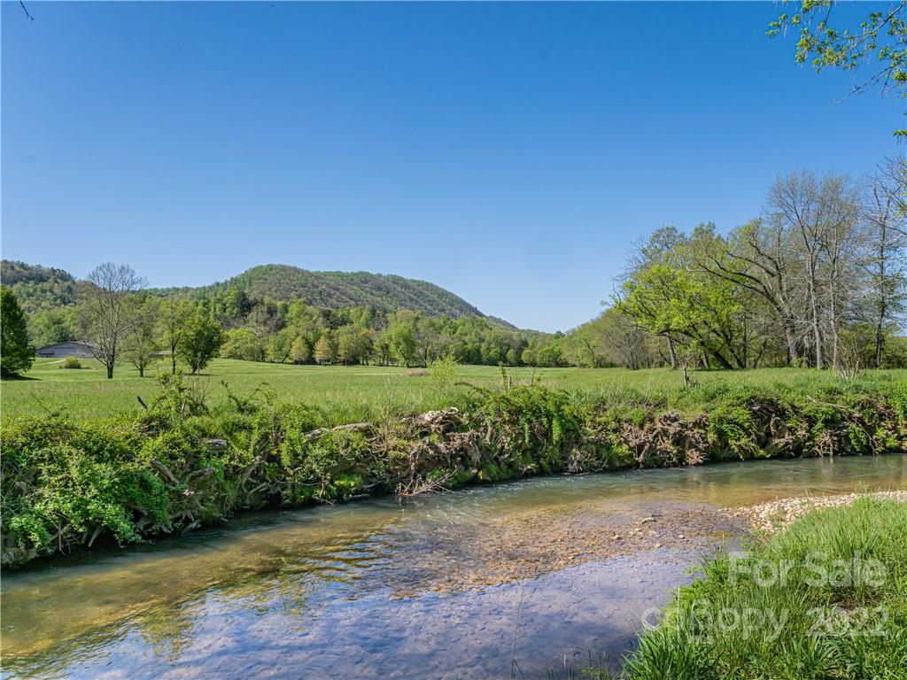 1030 Cane Creek Road Fletcher, NC 28732 - Photo 38 of 48 a view of a lake with a city view
