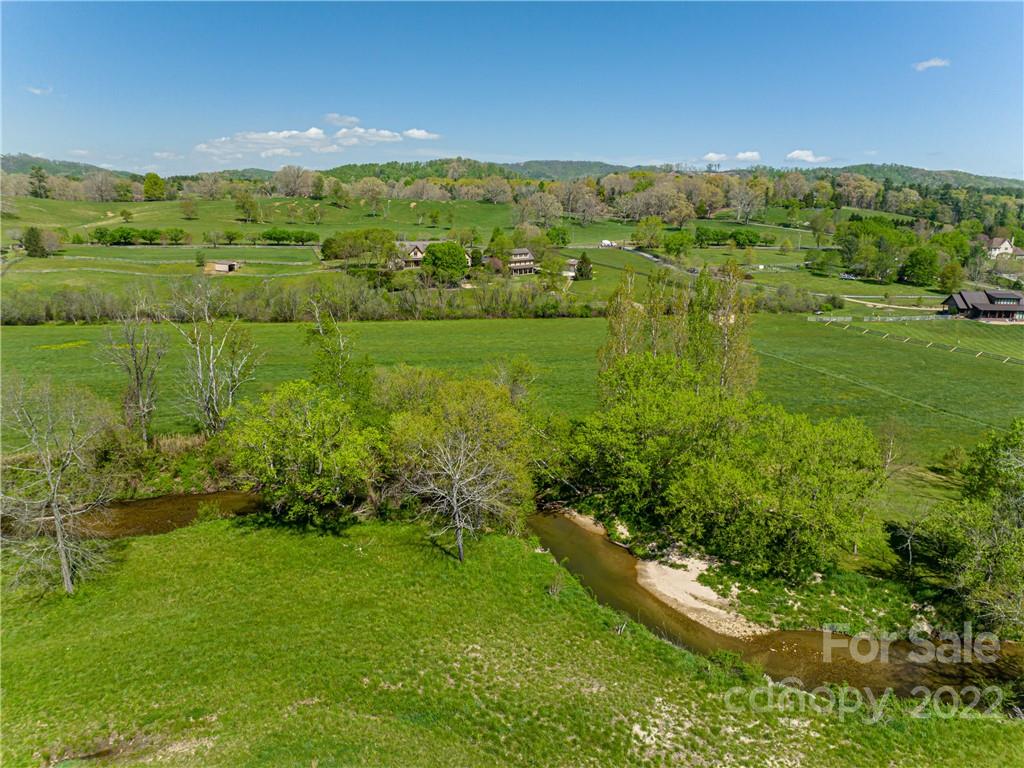 1030 Cane Creek Road Fletcher, NC 28732 - Photo 40 of 48 a view of a green field with clear sky