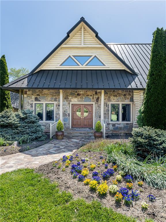 1030 Cane Creek Road Fletcher, NC 28732 - Photo 4 of 48 a view of a house with a yard and sitting area