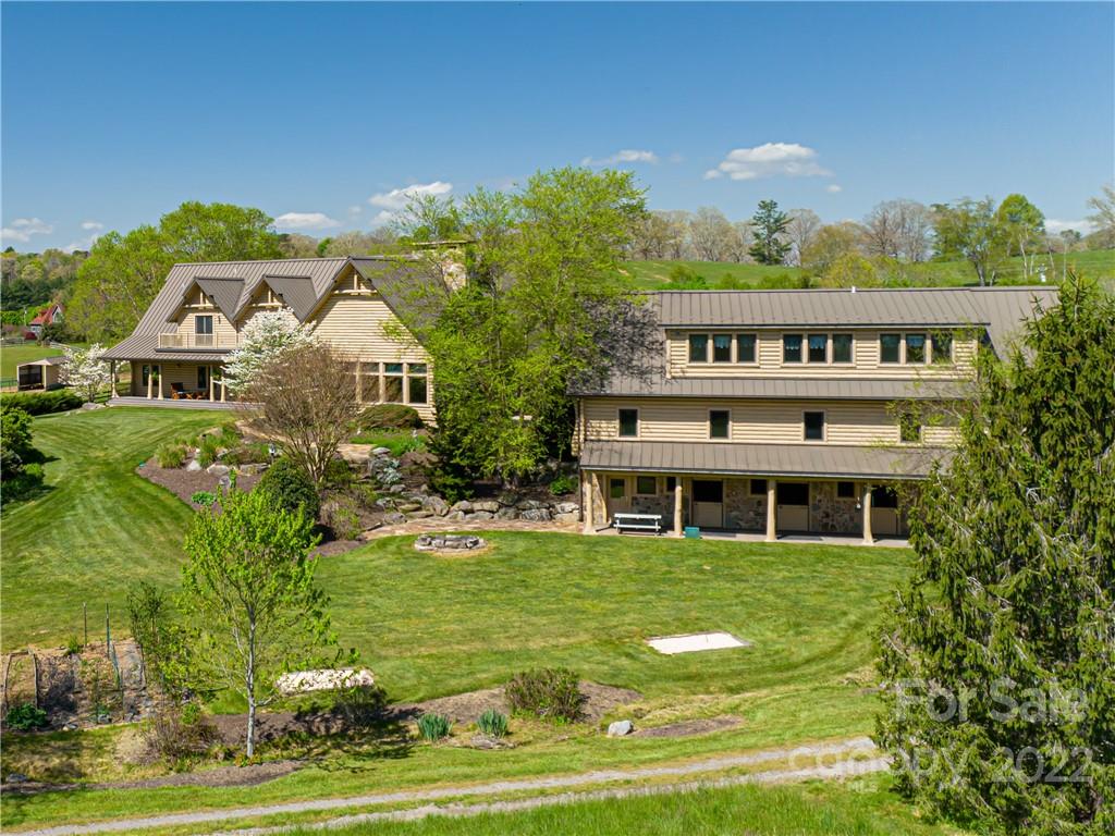 1030 Cane Creek Road Fletcher, NC 28732 - Photo 43 of 48 a view of a house with a yard