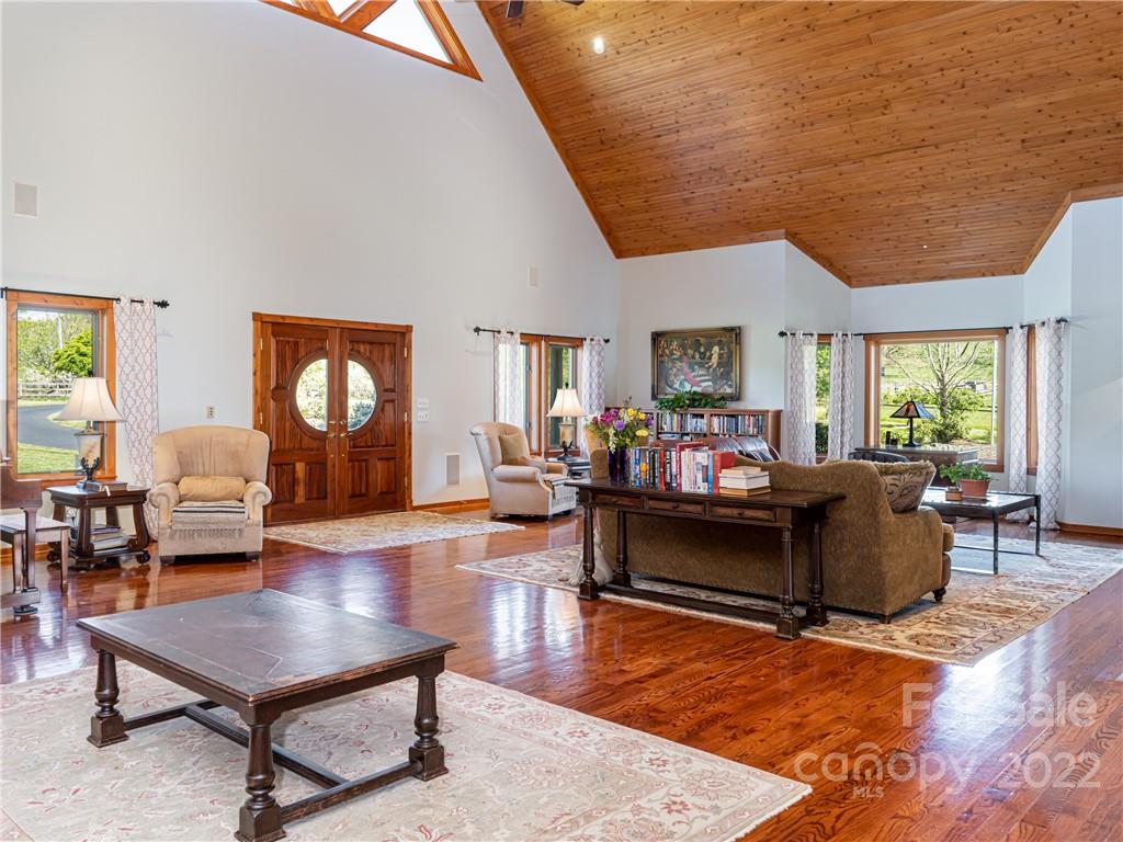 1030 Cane Creek Road Fletcher, NC 28732 - Photo 6 of 48 a living room with furniture and a wooden floor
