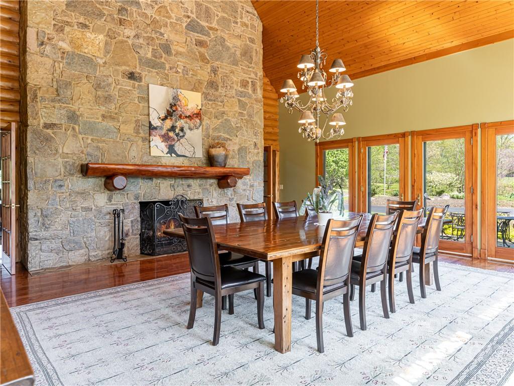 1030 Cane Creek Road Fletcher, NC 28732 - Photo 8 of 48 a dining room with furniture a large window and a chandelier