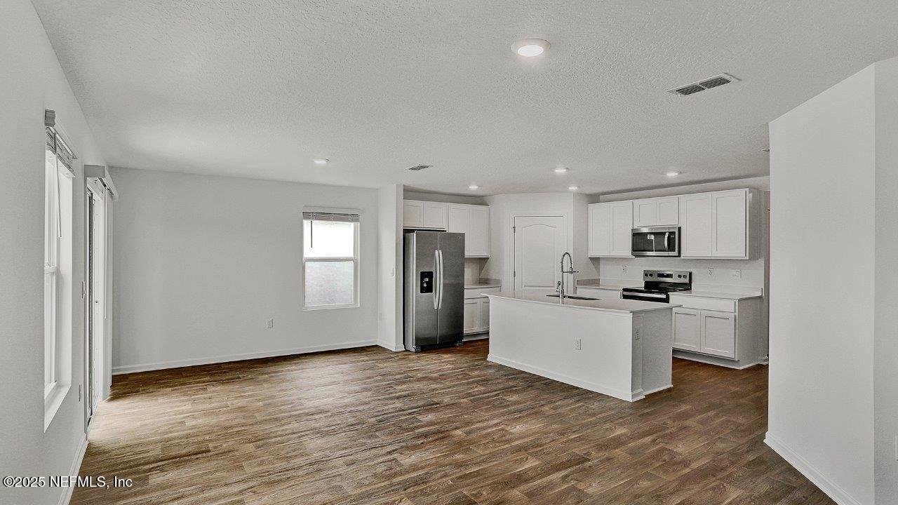 5645 Rustic Thorn Road Jacksonville, FL 32219 - Photo 6 of 45 a view of kitchen with wooden floor