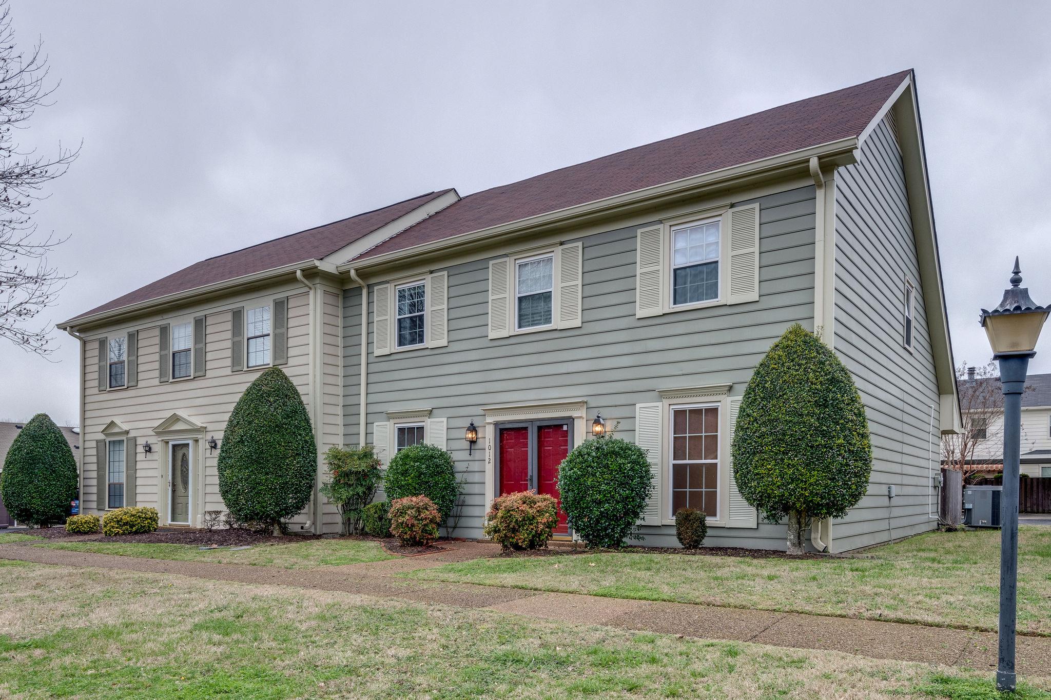 1012 General George Patton Road Nashville, TN 37221 - Photo 2 of 28 a front view of a house with a yard