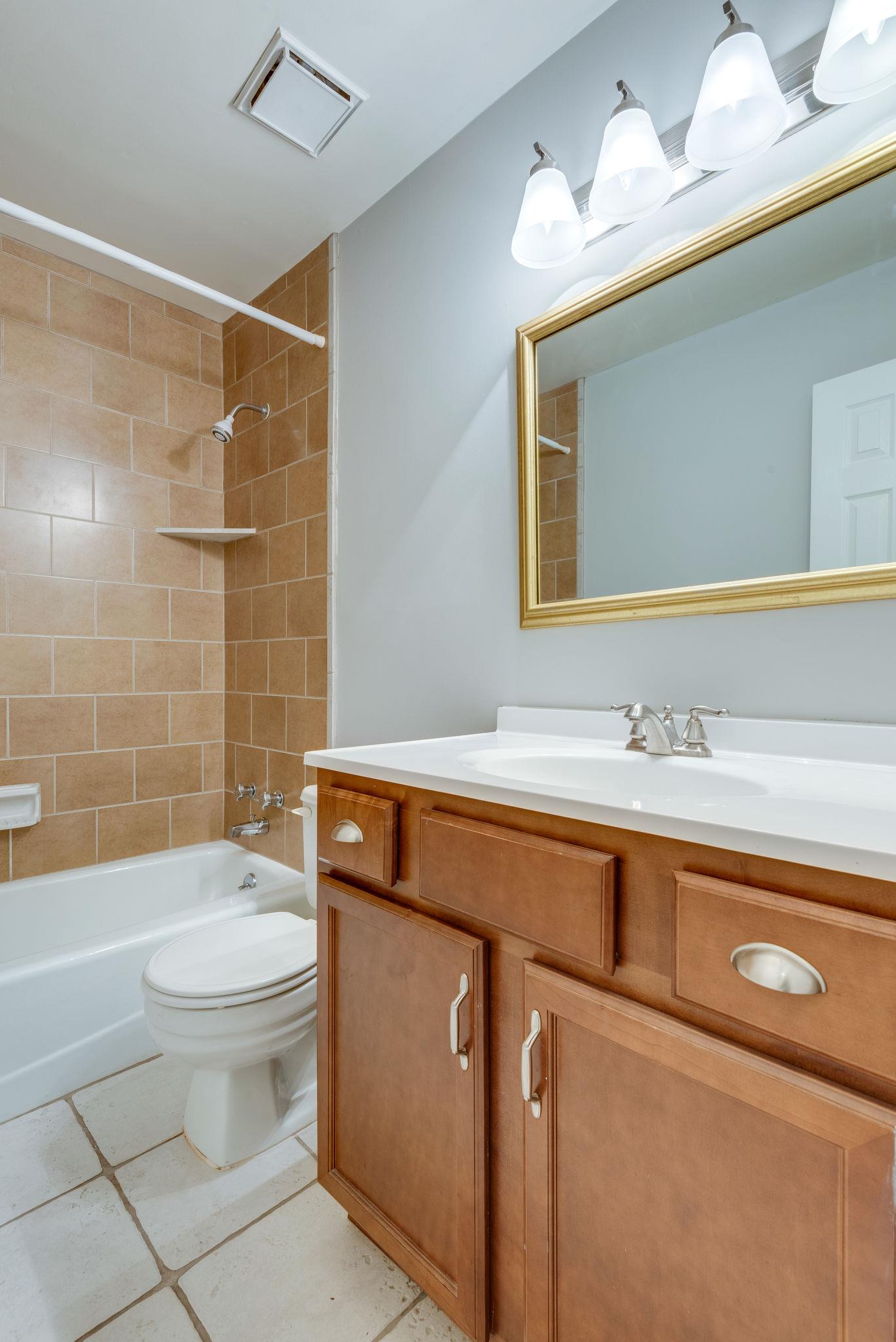 1012 General George Patton Road Nashville, TN 37221 - Photo 18 of 28 a bathroom with a sink a toilet and shower