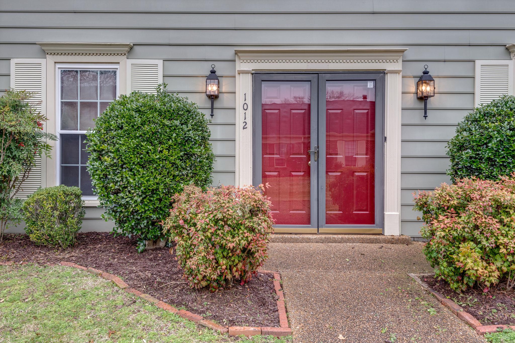 1012 General George Patton Road Nashville, TN 37221 - Photo 3 of 28 a front view of a house with a yard