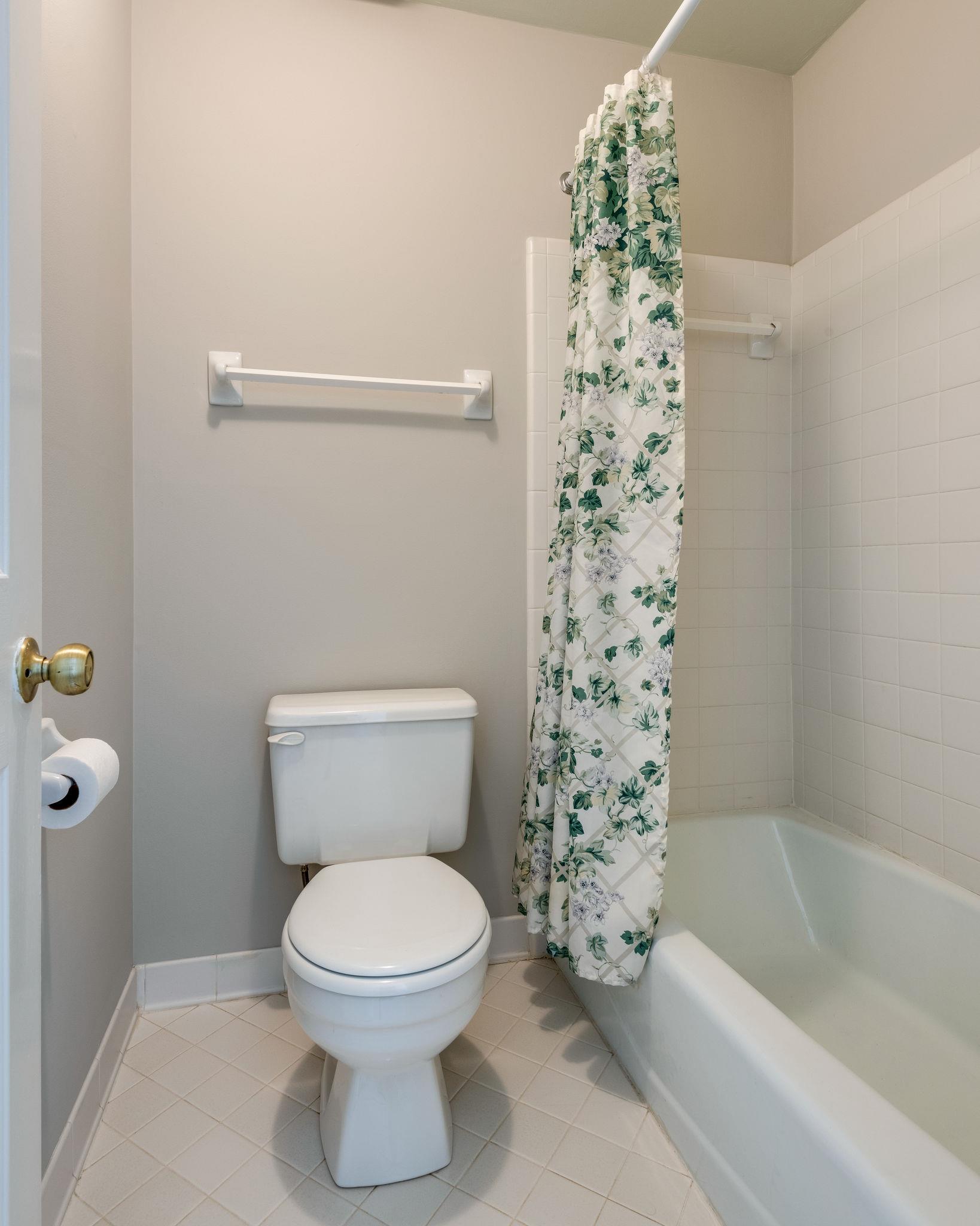 1012 General George Patton Road Nashville, TN 37221 - Photo 21 of 28 a bathroom with a toilet and a bathtub
