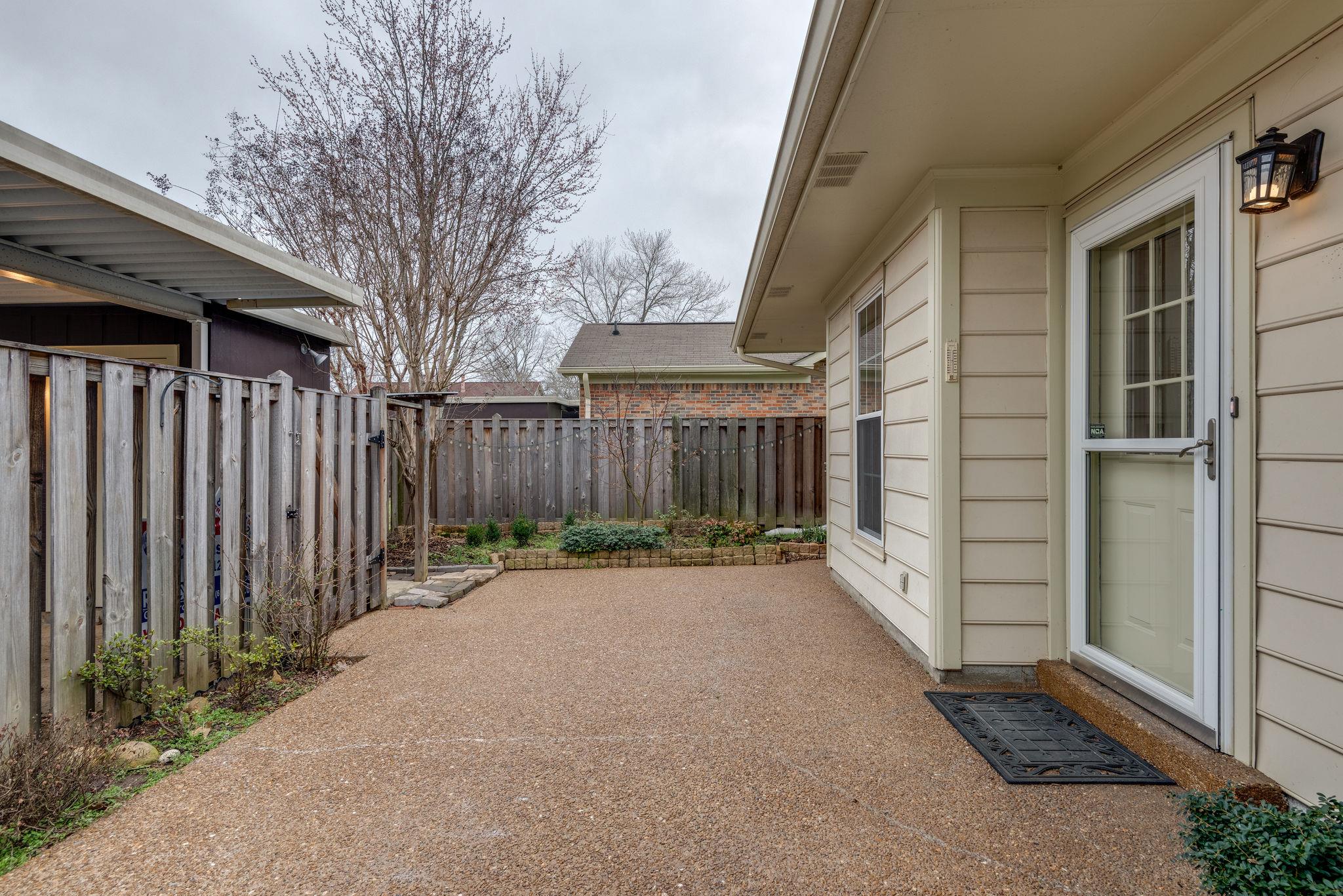 1012 General George Patton Road Nashville, TN 37221 - Photo 25 of 28 a backyard of a house with wooden fence