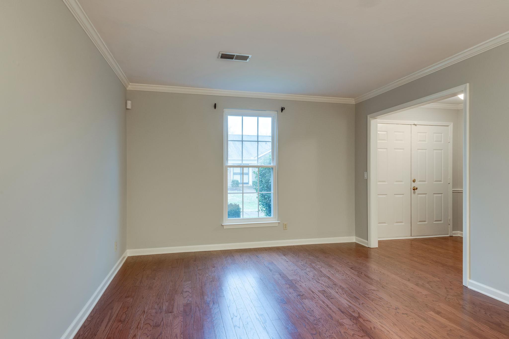 1012 General George Patton Road Nashville, TN 37221 - Photo 5 of 28 an empty room with wooden floor and windows