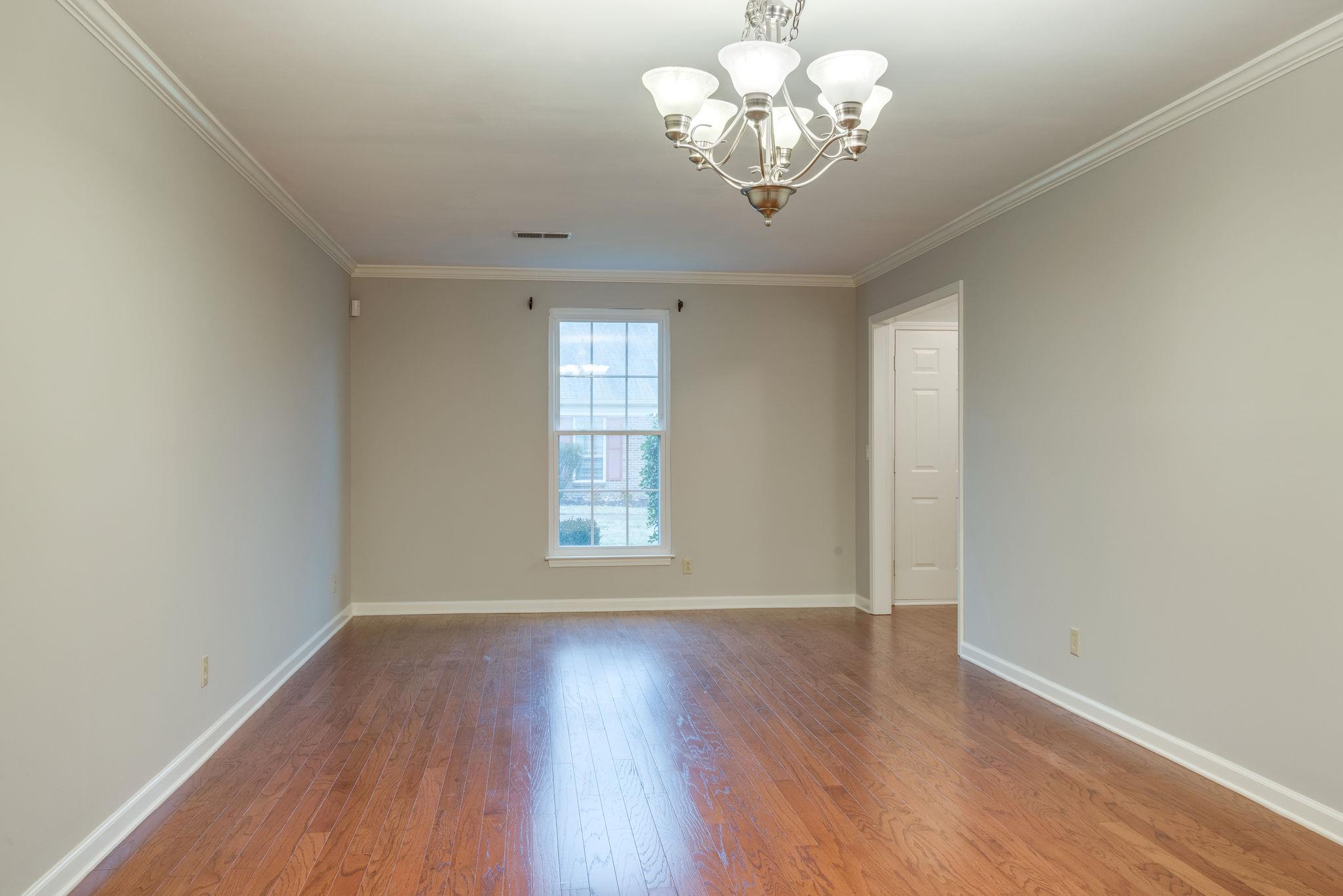 1012 General George Patton Road Nashville, TN 37221 - Photo 6 of 28 an empty room with wooden floor and windows