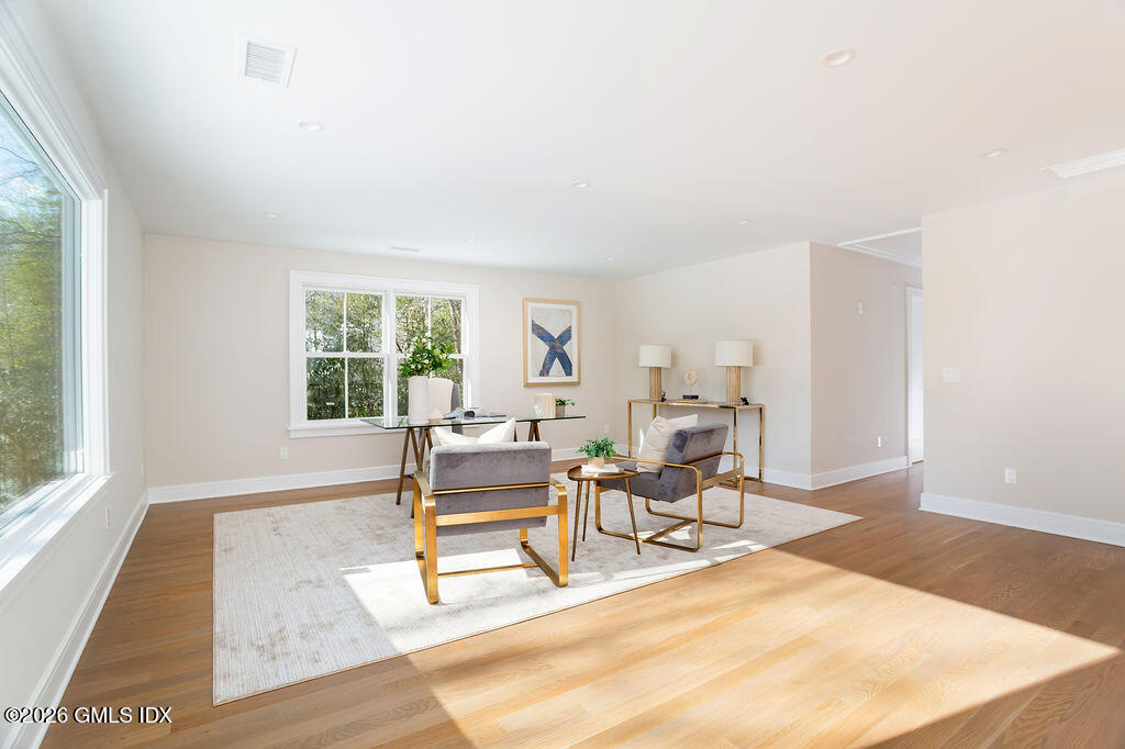49 Salisbury Road Darien, CT 06820 - Photo 31 of 40 a living room with furniture and a window