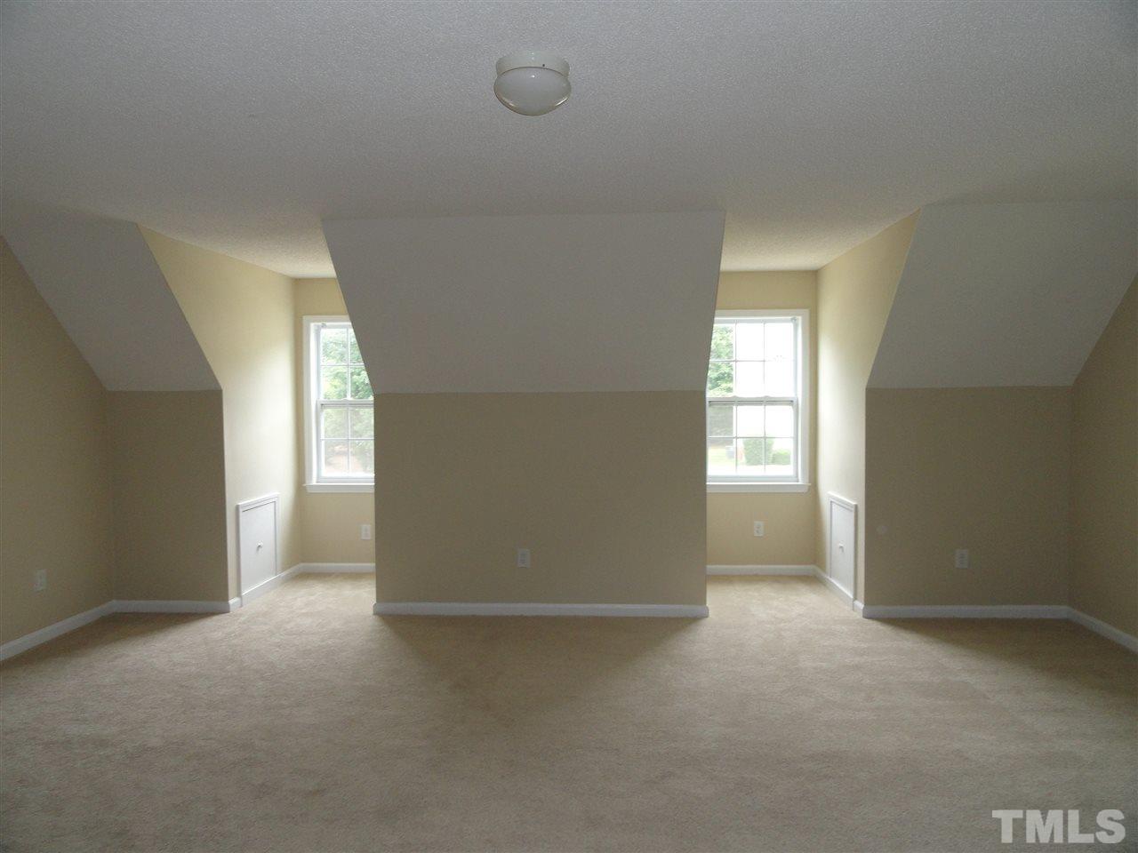 1097 Alderman Circle Raleigh, NC 27603 - Photo 22 of 25 an empty room with windows