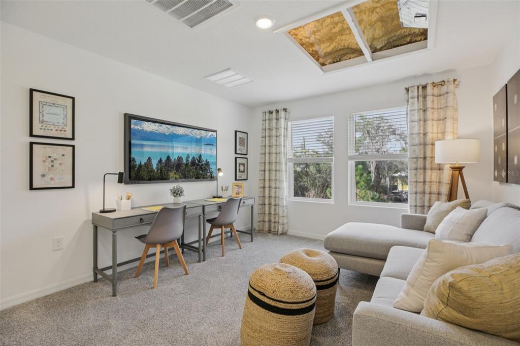 28005 Poppy Court Leesburg, FL 34748 - Photo 12 of 54 a living room with furniture and a large window
