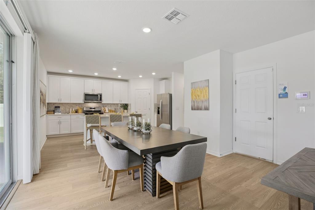 28005 Poppy Court Leesburg, FL 34748 - Photo 16 of 54 a view of a dining room with furniture