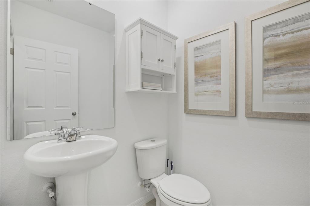 28005 Poppy Court Leesburg, FL 34748 - Photo 25 of 54 a bathroom with a sink toilet and shower
