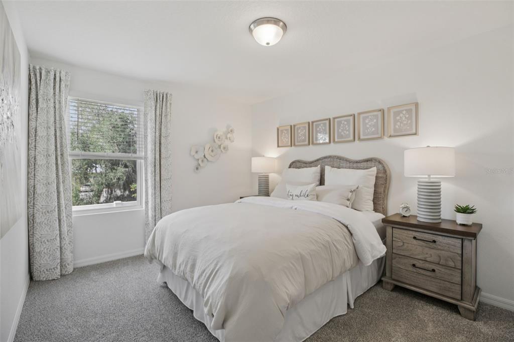 28005 Poppy Court Leesburg, FL 34748 - Photo 26 of 54 a bedroom with a bed and a window