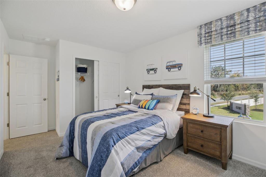 28005 Poppy Court Leesburg, FL 34748 - Photo 32 of 54 a bed room with a bed and a window