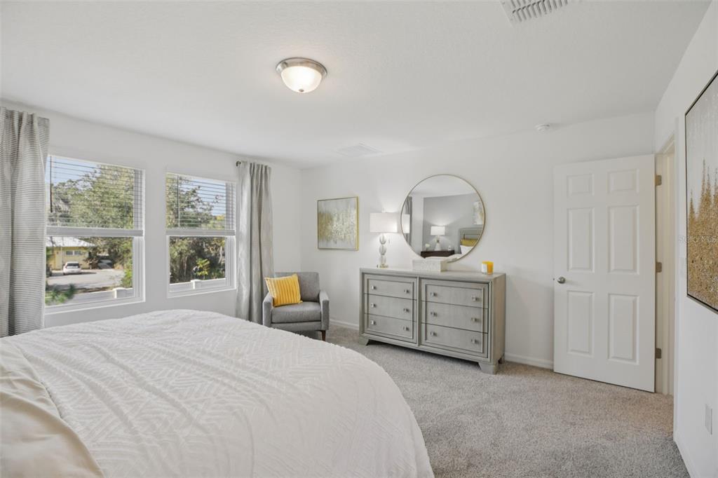 28005 Poppy Court Leesburg, FL 34748 - Photo 38 of 54 a bed room with a bed and a dresser