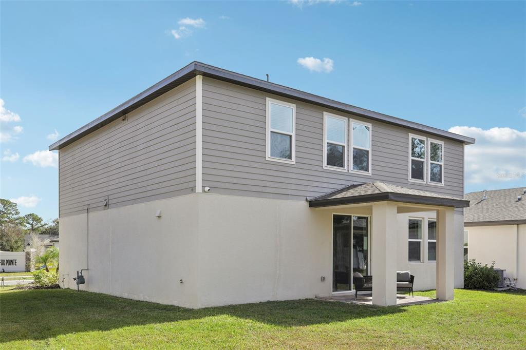 28005 Poppy Court Leesburg, FL 34748 - Photo 50 of 54 a front view of a house with a yard