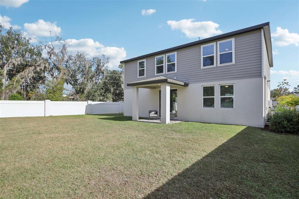 28005 Poppy Court Leesburg, FL 34748 - Photo 53 of 54 a view of backyard of house and trees