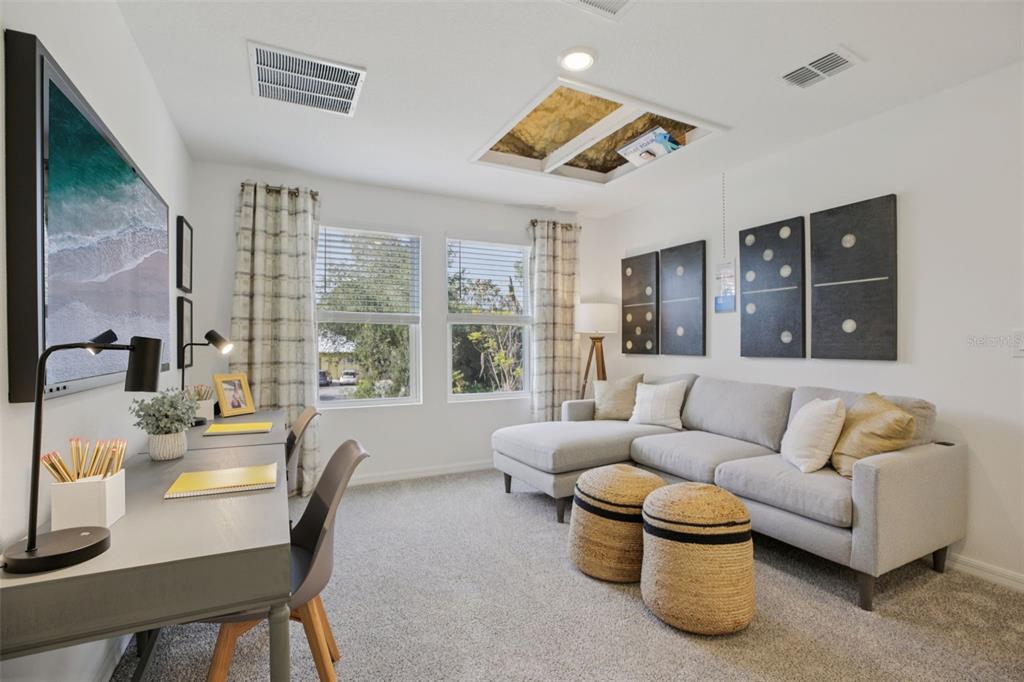 28005 Poppy Court Leesburg, FL 34748 - Photo 9 of 54 a living room with furniture and a large window