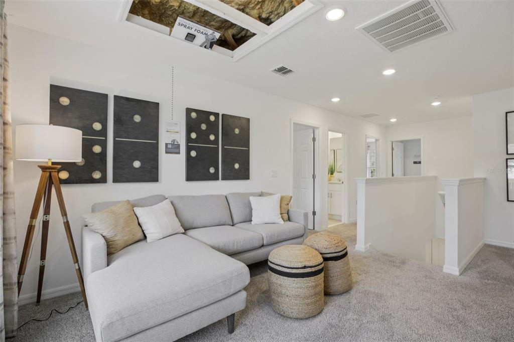 28005 Poppy Court Leesburg, FL 34748 - Photo 10 of 54 a living room with furniture and kitchen view