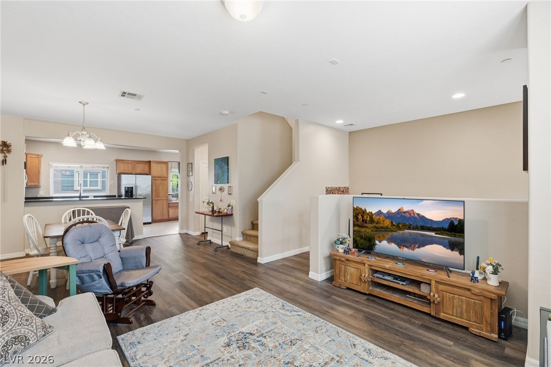 4650 Ranch House Road, Unit 126 North Las Vegas, NV 89031 - Photo 8 of 44 This inviting open layout showcases a cohesive design, seamlessly connecting the living area with an adjacent dining area. (combined space: 25'X12')