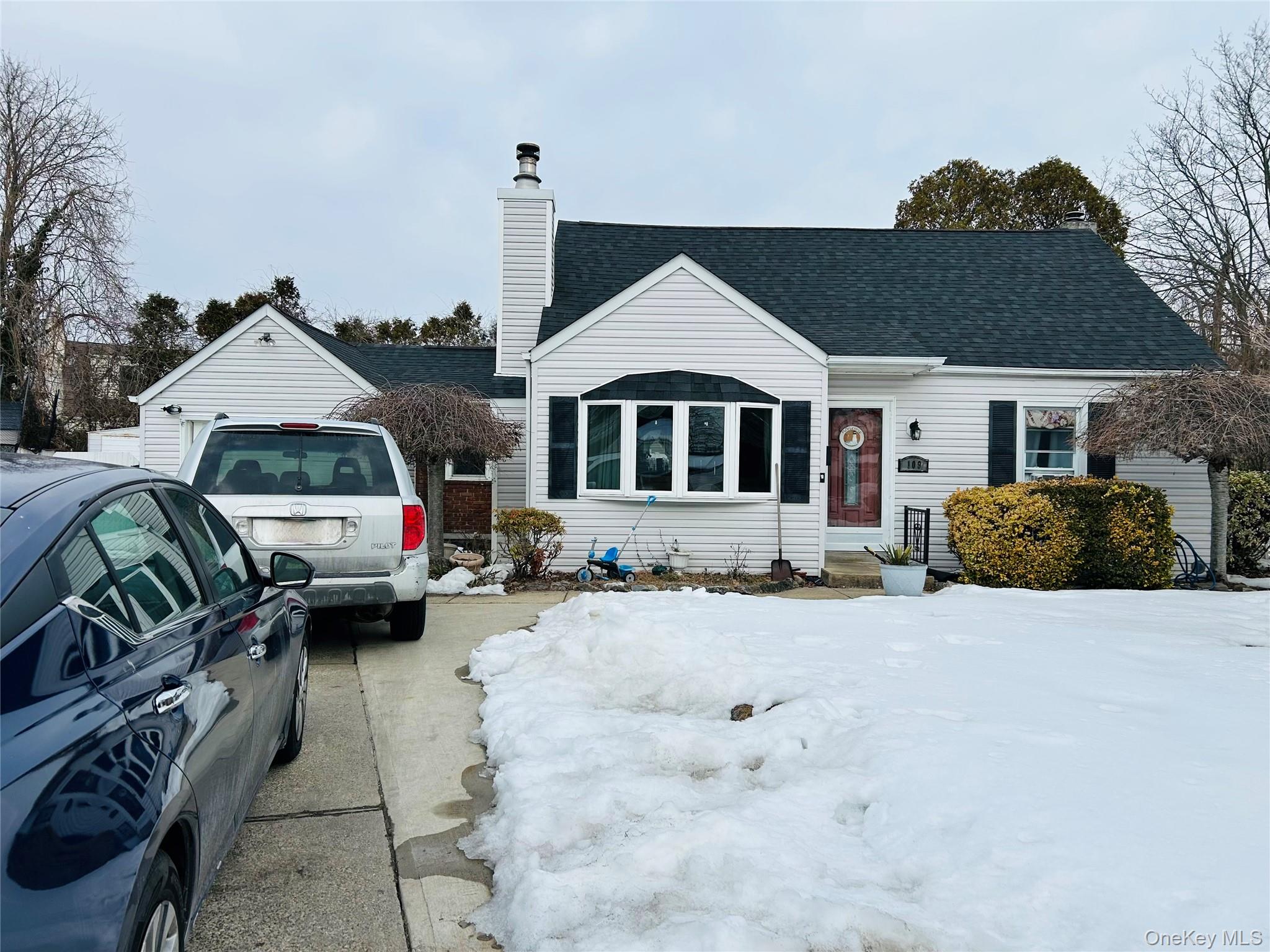 109 Vesper Court Babylon, NY 11702 - Photo 2 of 3 a view of a house with a yard