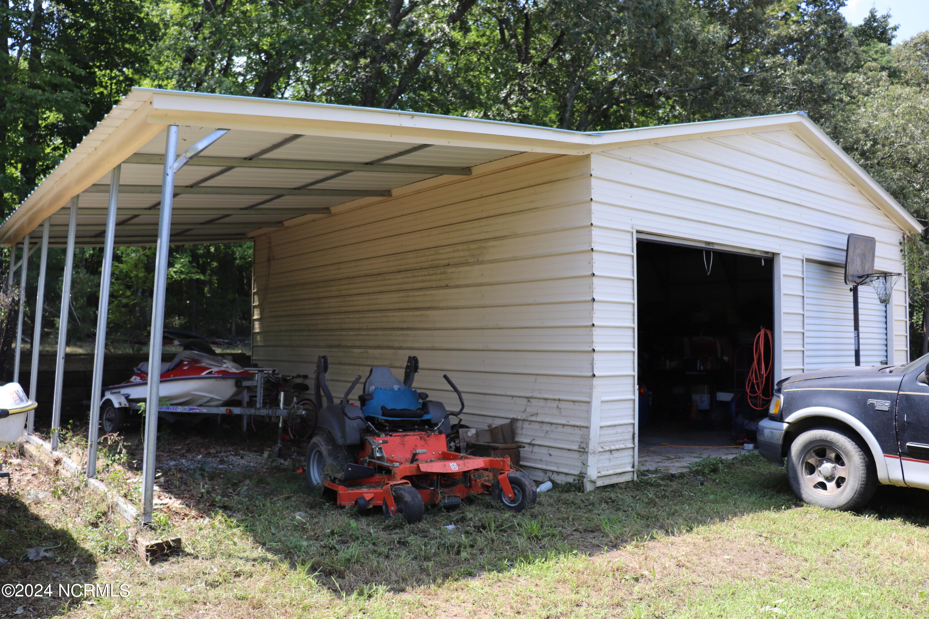 165 Kmj Ranch Road Troy, NC 27371 - Photo 26 of 58 Storage building with lean to shelter