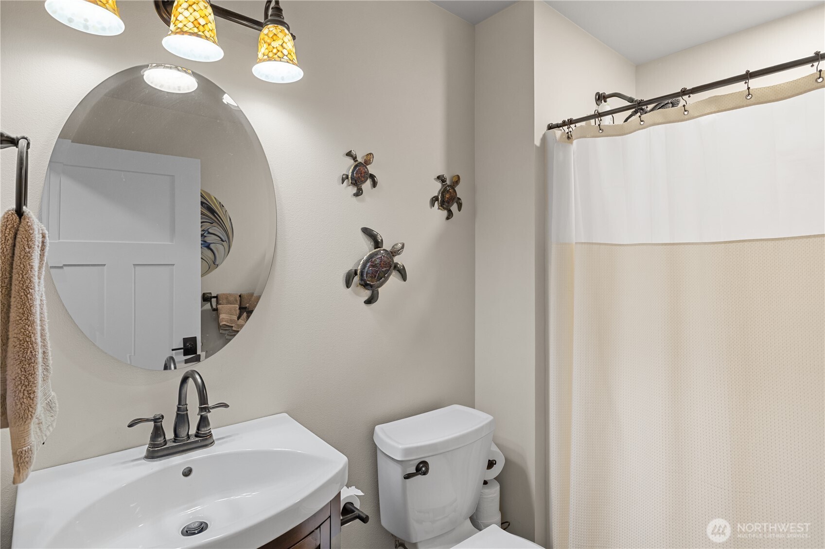 111 Wren Loop Southwest Mattawa, WA 99349 - Photo 25 of 40 a bathroom with a sink and mirror with toilet