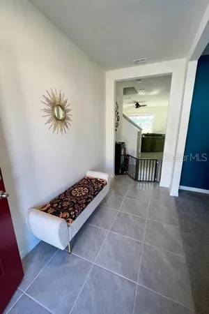 a view of workspace with furniture and window