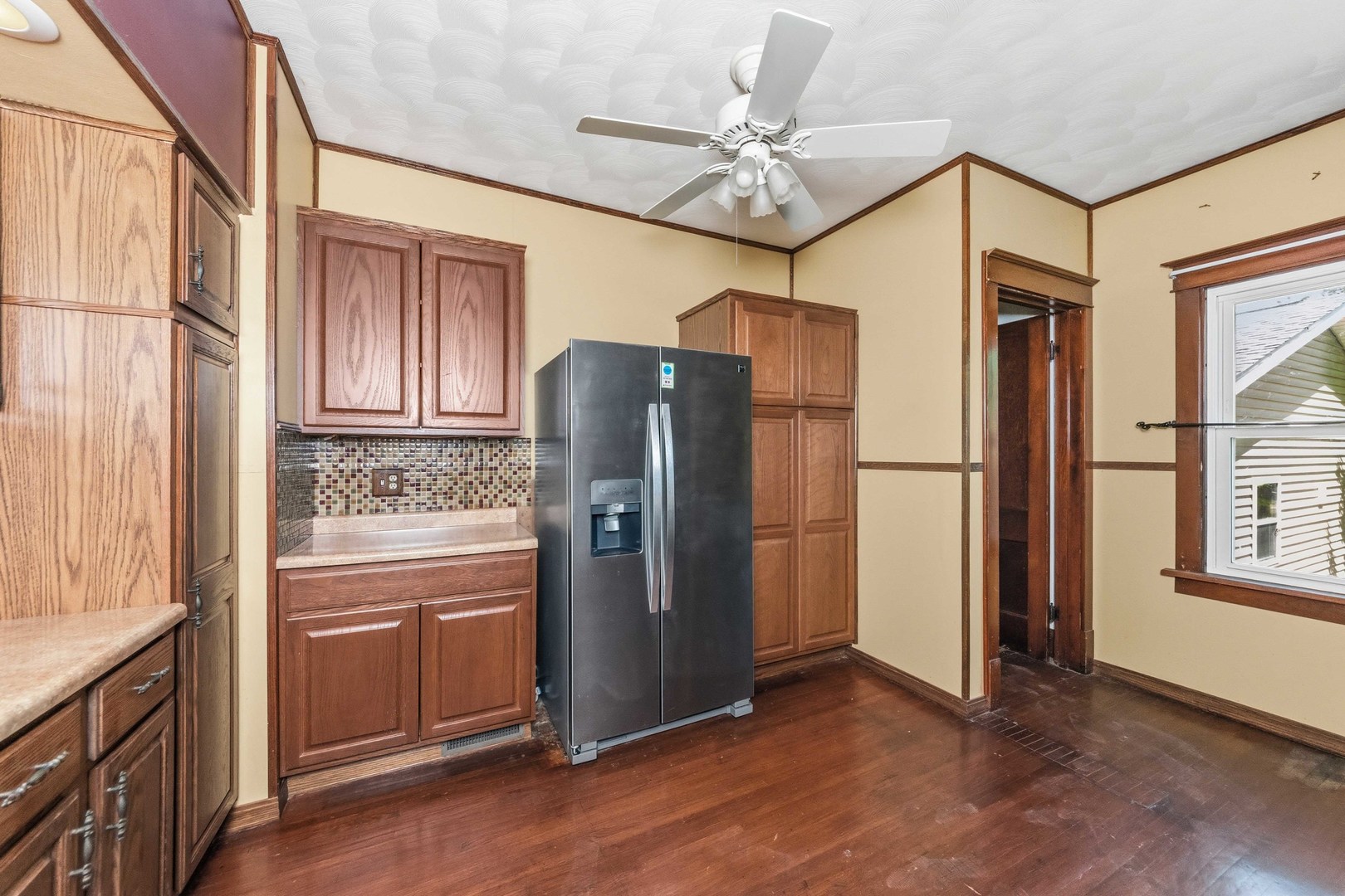 412 West 5th Street Minonk, IL 61760 - Photo 9 of 23 a kitchen with stainless steel appliances granite countertop a refrigerator a oven and a refrigerator with wooden floor