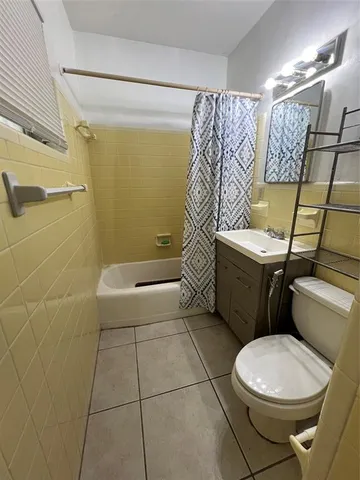 a living room with furniture a window and a table