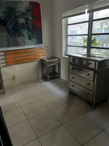 a kitchen with a stove and a refrigerator