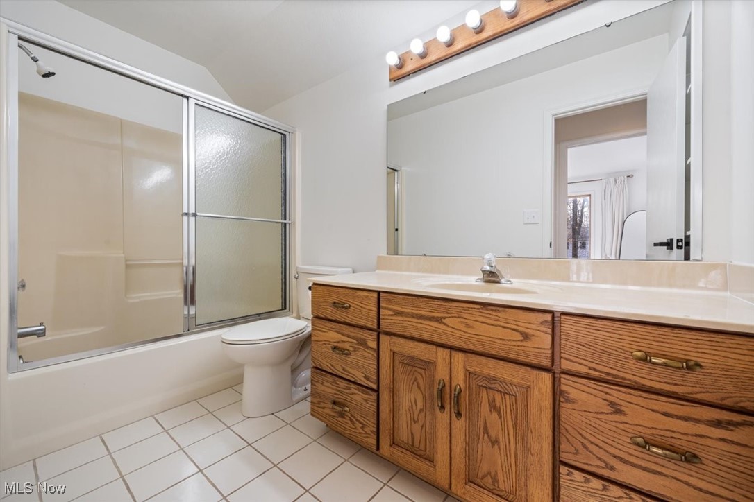 3520 Hunting Run Road Medina, OH 44256 - Photo 37 of 47 Full bathroom featuring tile patterned floors, vanity, toilet, and combined bath / shower with glass door