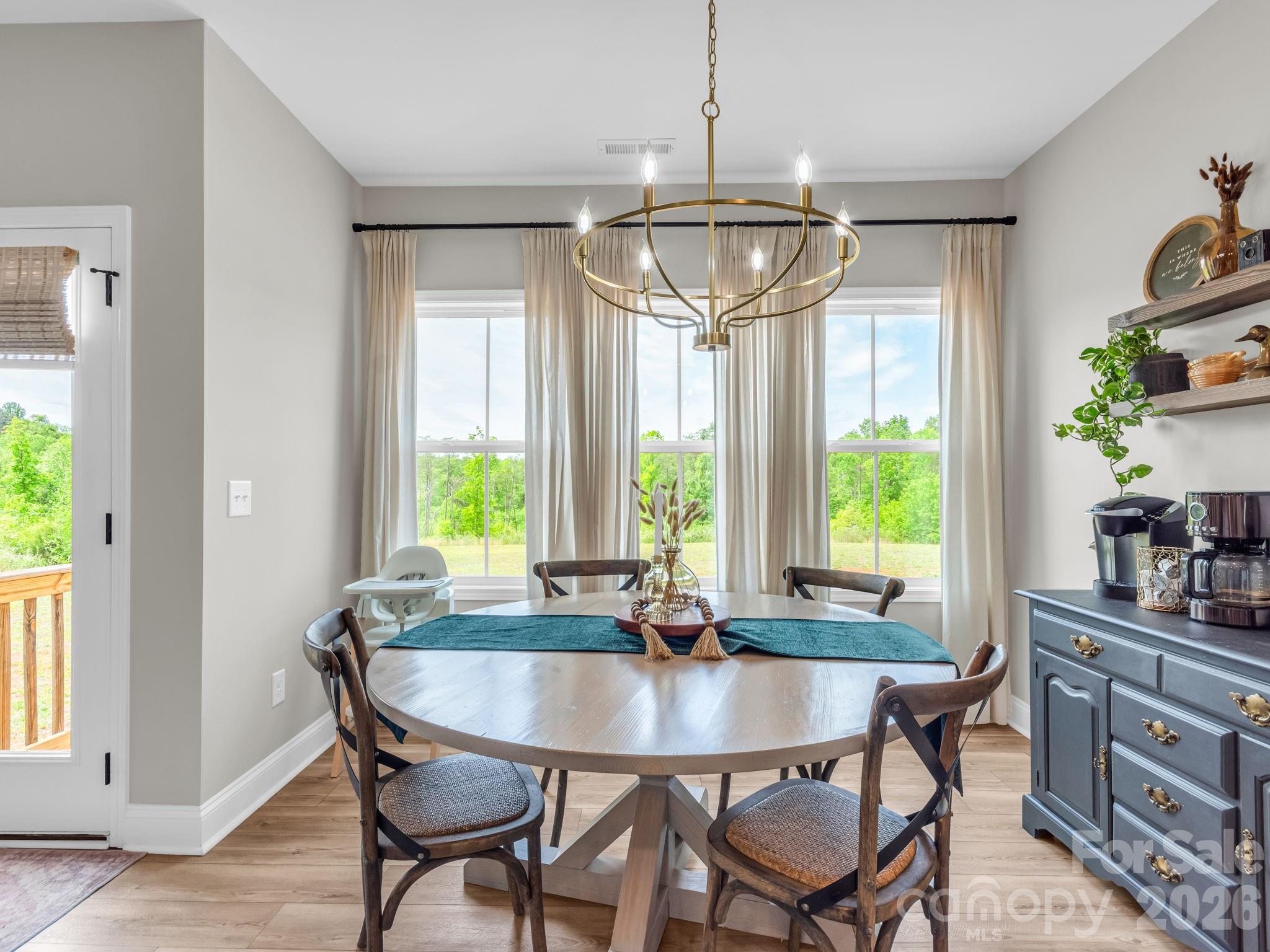 288 Maypole Court Forest City, NC 28043 - Photo 12 of 47 a view of a dining room with furniture window and outside view
